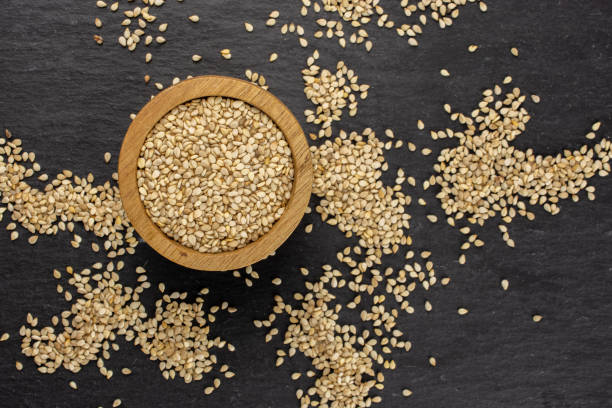 istock Unpeeled sesame seeds on grey stone 1166497144
