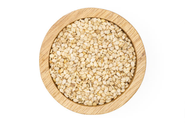 istock Unpeeled sesame seeds isolated on white 1166497146
