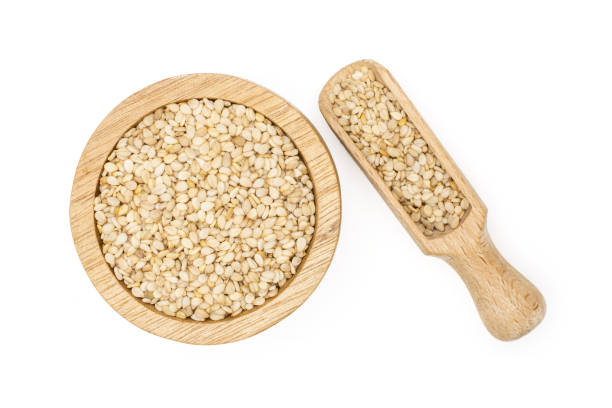 istock Unpeeled sesame seeds isolated on white 1166497155