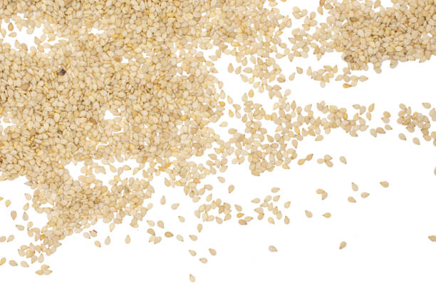 istock Unpeeled sesame seeds isolated on white 1166497218