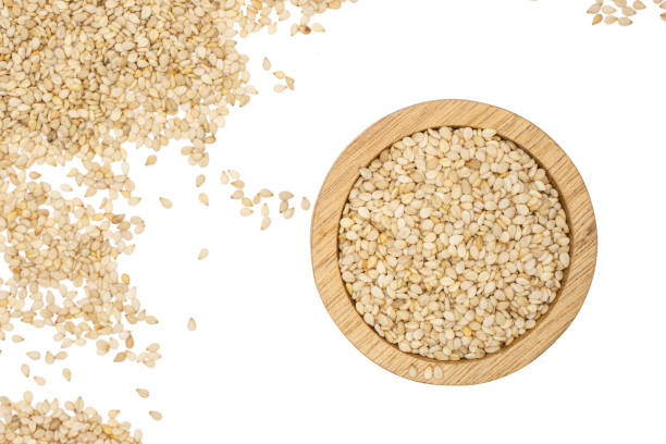 Unpeeled sesame seeds isolated on white