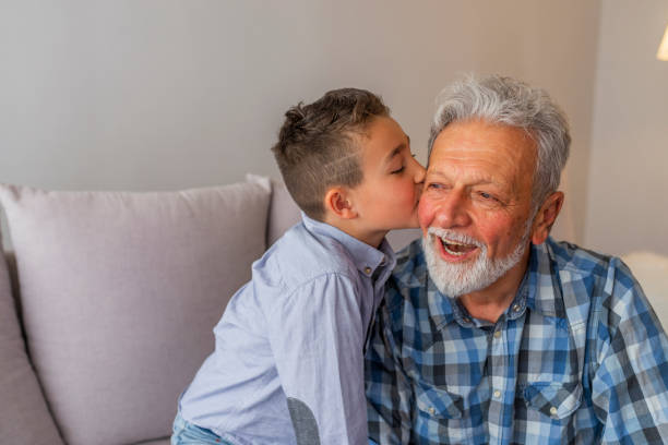 istock Child kiss grandfather 1166497243