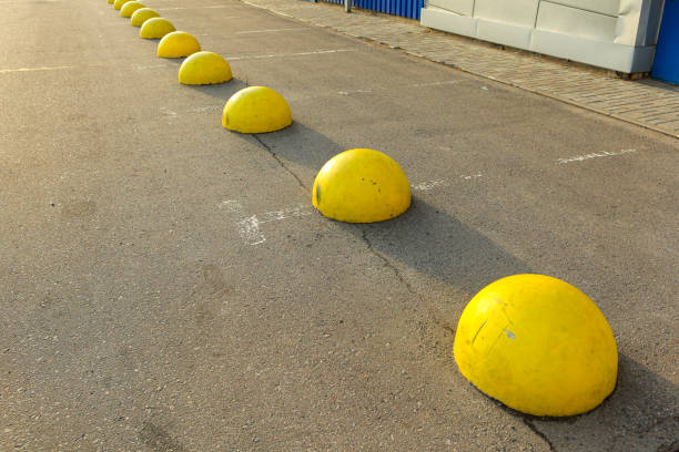 istock Yellow concrete hemispheres on the parking lot 1166497383