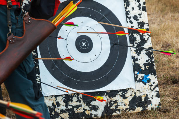istock Arrows stick out in a round target. 1166497513