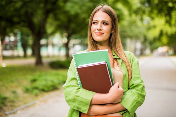 istock Charming young college girl. 1166505034