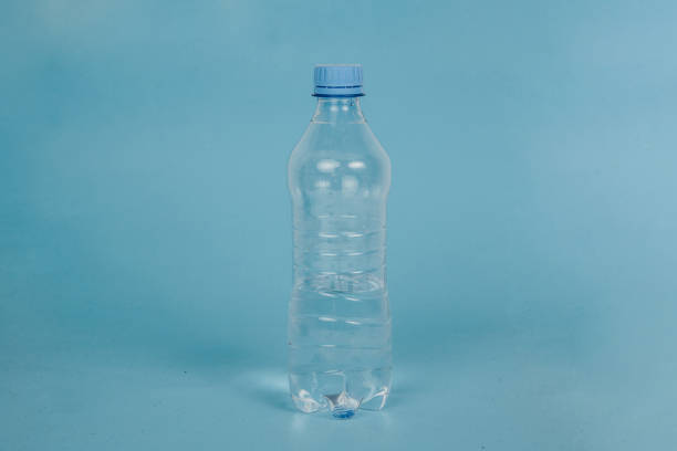 istock Plastic bottle on a blue background. Concept of caring for the environment, recycling. Secondary plastic circuit. Environment pollution. 1166505053