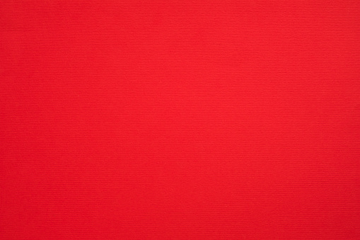 Crimson red felt texture abstract art background. Colored fabric fibers surface. Empty space.