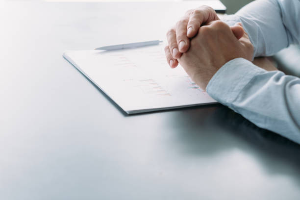 istock corporate meeting project manager desk graphs 1166511100