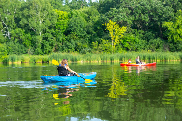 istock Family Kayaking On Lake On Summer Evening 1166516684