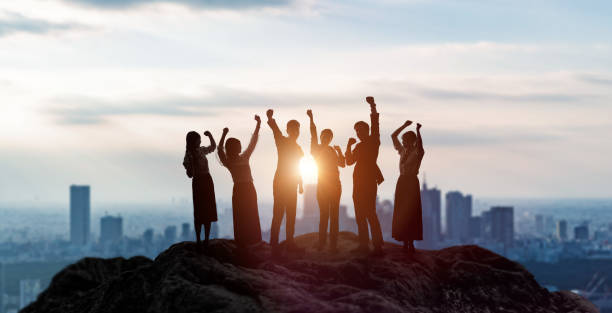 Silhouettes of happy businessperson. Success of business concept. Silhouettes of happy businessperson. Success of business concept. businesswomen group stock pictures, royalty-free photos & images