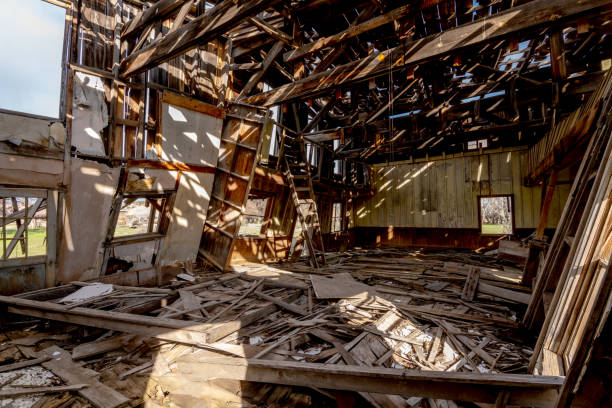 istock The interior of an old wood framed building slowly falling down 1166517559