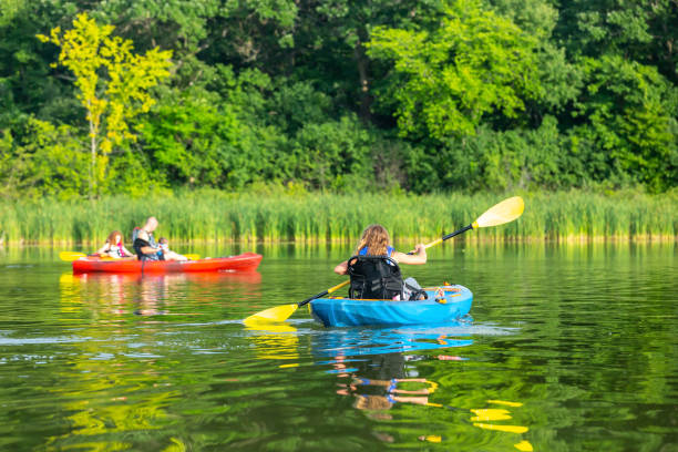 istock Family Kayaking On Lake On Summer Evening 1166520347