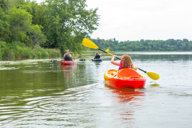 istock Family Kayaking On Lake On Summer Evening 1166521512
