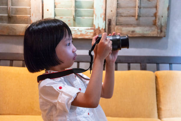 istock Asian Little Chinese Girl playing camera 1166526733