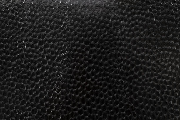 istock dark glass textured under snake scales highlighted in close-up with slight highlights on irregularities 1166534986
