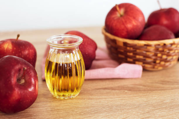 Close up red Apple fruit  and apple cider vinegar juice , Helps Lose Weight and Reduces Belly Fat , healthy food stock photo