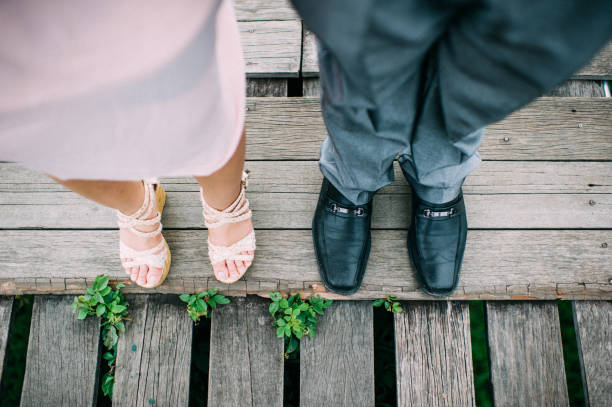 istock Feet of Wedding Couple 1166537198