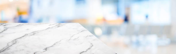 istock marble table top product display background with blur patient in hospital.left perspective stone kitchen counter with people waiting doctor in hallway.Banner mockup presentation for  health product 1166538266