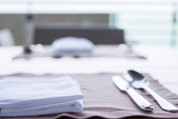 istock Table setting with plate, napkin and utensils for couple. 1166538299