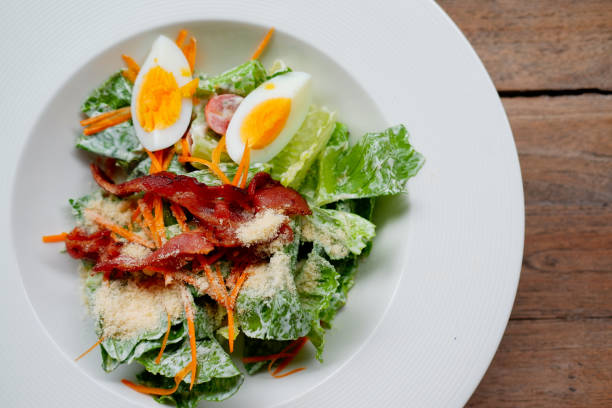 istock Top view vegetable salad with egg and bacon 1166541665