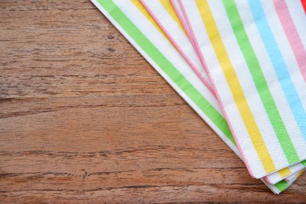 istock Coloful napkin on wooden background 1166545499