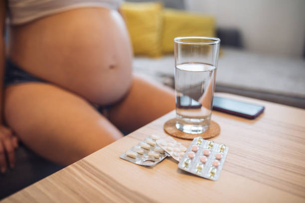 istock Pregnant woman drinking her morning medication 1166547533