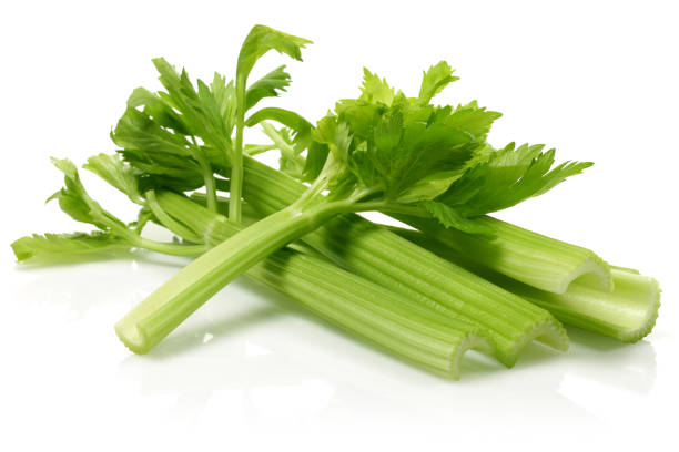 istock Fresh celery stalks and leaves isolated on white 1166547824