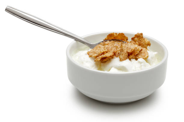 istock Cereal and yoghurt in bowl isolated on white 1166548519