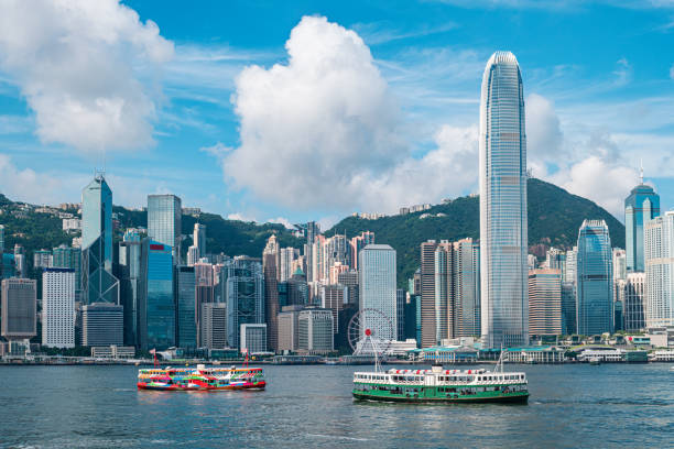 Hong Kong Skyline and Victoria Harbor Hong Kong Skyline and Victoria Harbor central district hong kong stock pictures, royalty-free photos & images