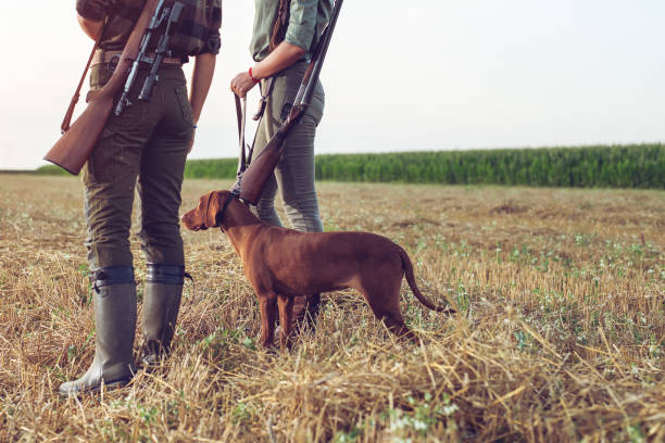 istock Women hunters with hunting dog 1166551138