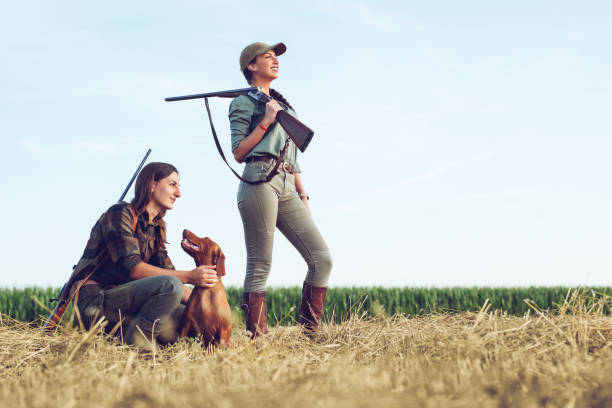 istock Women hunters with hunting dog 1166551184