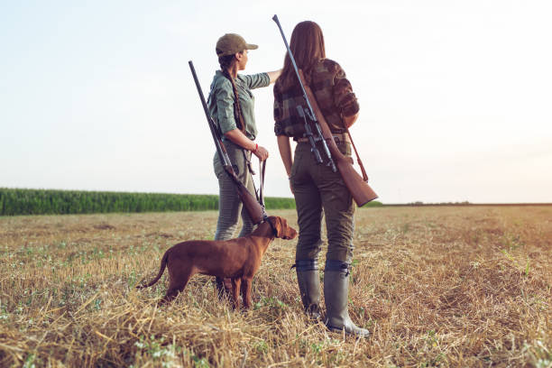 istock Women hunters with hunting dog 1166551229