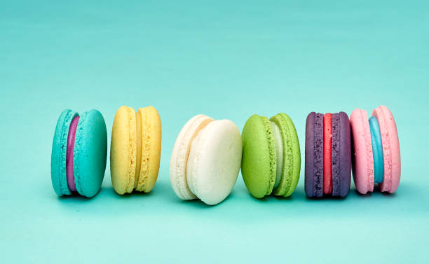 istock Bright colorful group of macaron on pastel blue background 1166551305