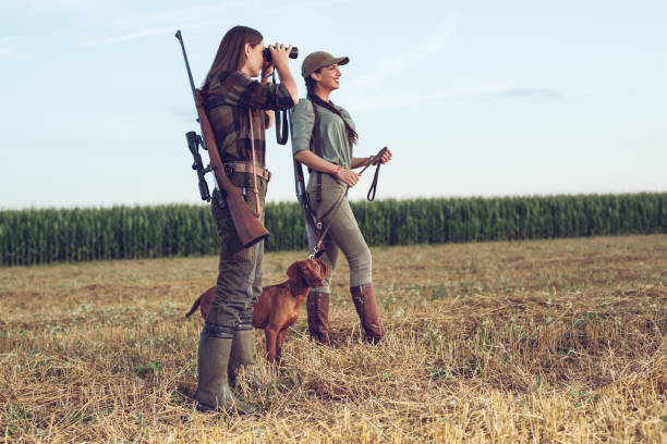 istock Women hunters with hunting dog 1166551309