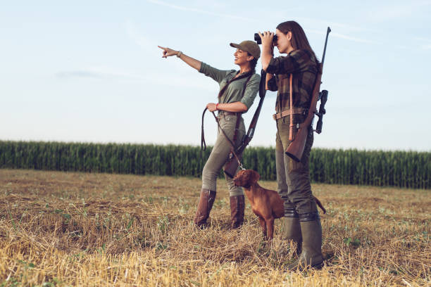 istock Women hunters with hunting dog 1166551385