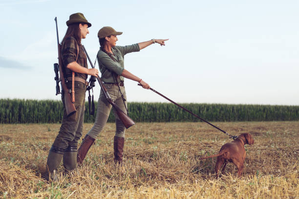 istock Women hunters with hunting dog 1166551537
