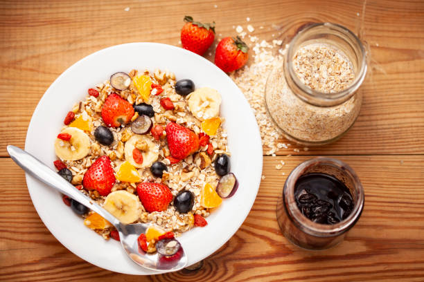 istock Healthy oats breakfast with various fruit toppings and fruit jam. 1166552311
