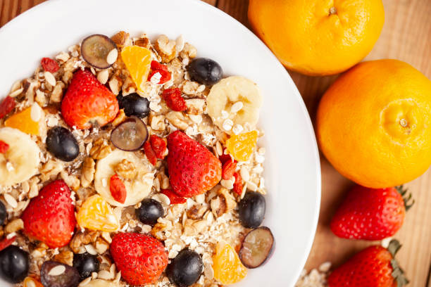istock Healthy oats breakfast with various fruit toppings and strawberry. 1166552321