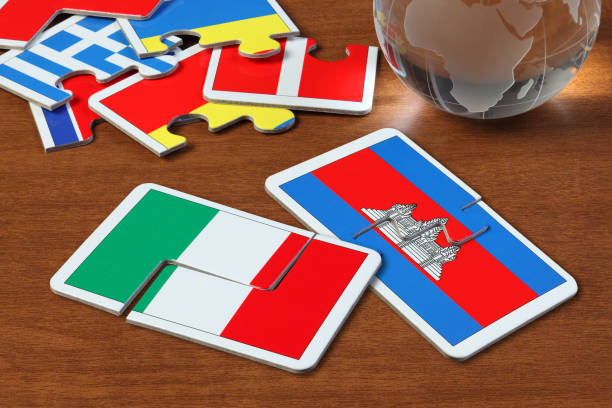 istock Italy and Cambodia Flags in puzzle 1166553564