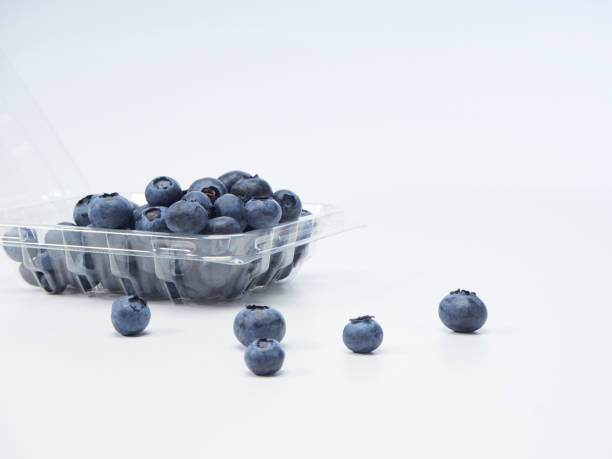 istock Fresh blueberry in a clear box on a white background. 1166553813