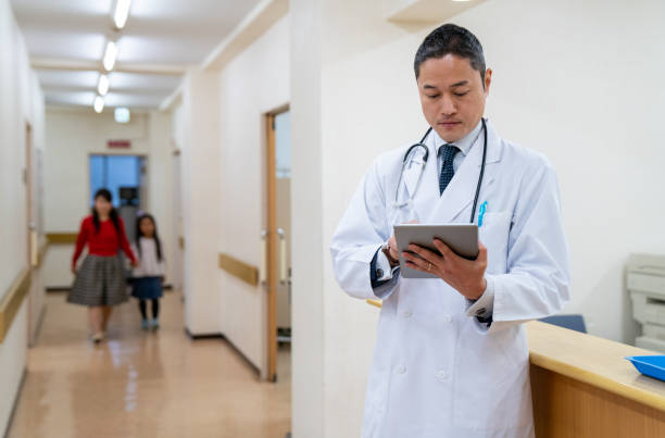 istock Doctor checking a digital tablet in a hospital 1166553963