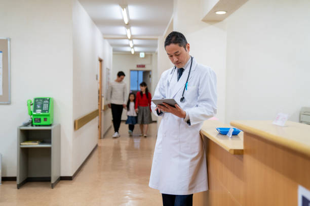istock Doctor checking a digital tablet in a hospital 1166554001