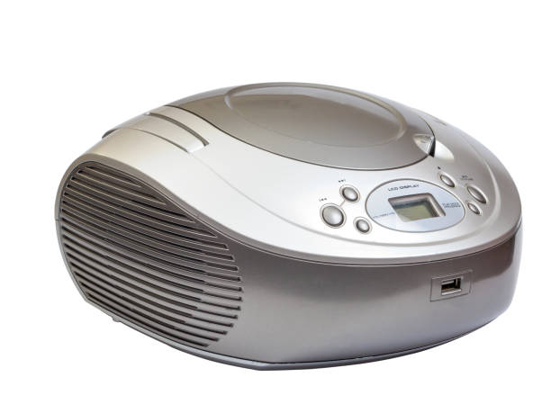 Silver stereo CD radio cassette recorder isolated on white Silver stereo CD radio cassette recorder isolated on white. vintage portable silver radio stock pictures, royalty-free photos & images