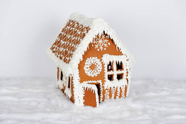 istock The hand-made eatable gingerbread house and snow decoration 1166557509
