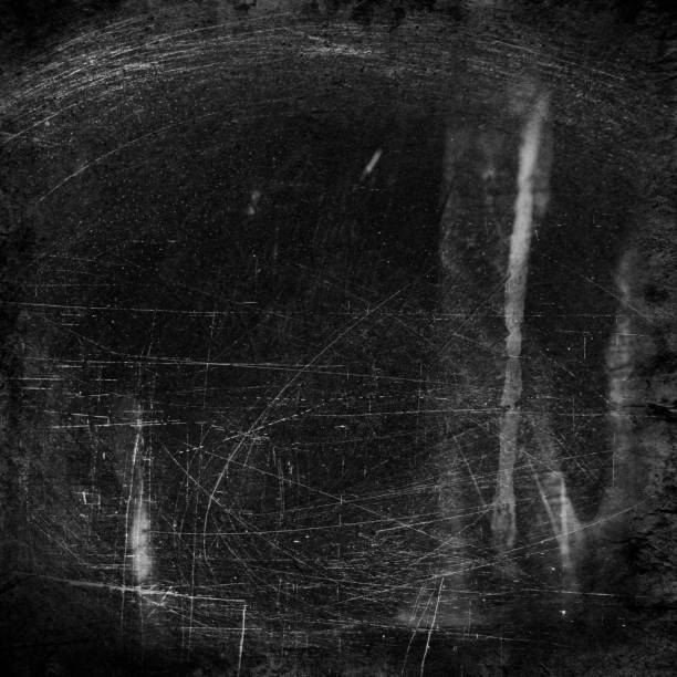 istock Scratched surface of a black and white film 1166557566