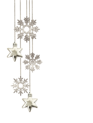 Christmas arrangement with hanging decorative silver stars and glitter snowflakes isolated on white background