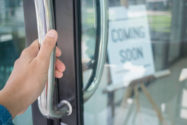 istock Woman hand opening see through door 1166559077