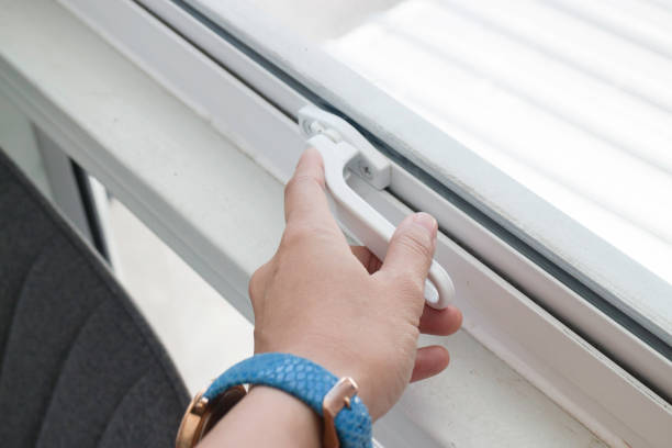 istock Woman hand opening see through window 1166559080