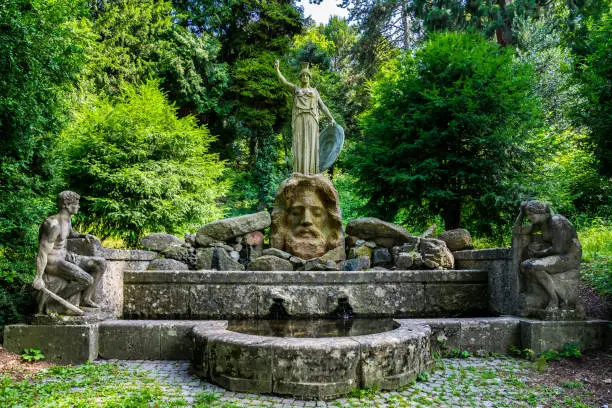 Germany, Ancient famous spring called athenenbrunnen with sculptures of zeus, prometheus and pandora in public park of stuttgart city near karslhoehe