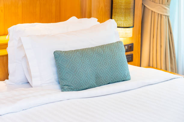 istock Beautiful luxury comfortable white pillow blanket on bed decoration in bedroom 1166560570